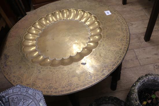 An Indian brass tray top table